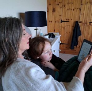 Grandmother reads Kindle version of Pete The Squirrel to her grandson
